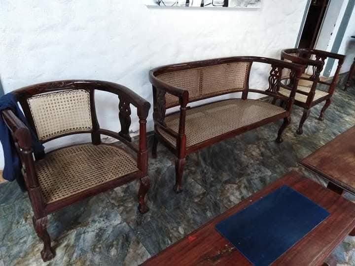 Curved cane settee set after restoration