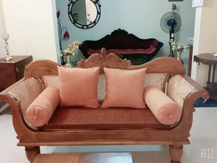 Cane settee during reweaving in workshop