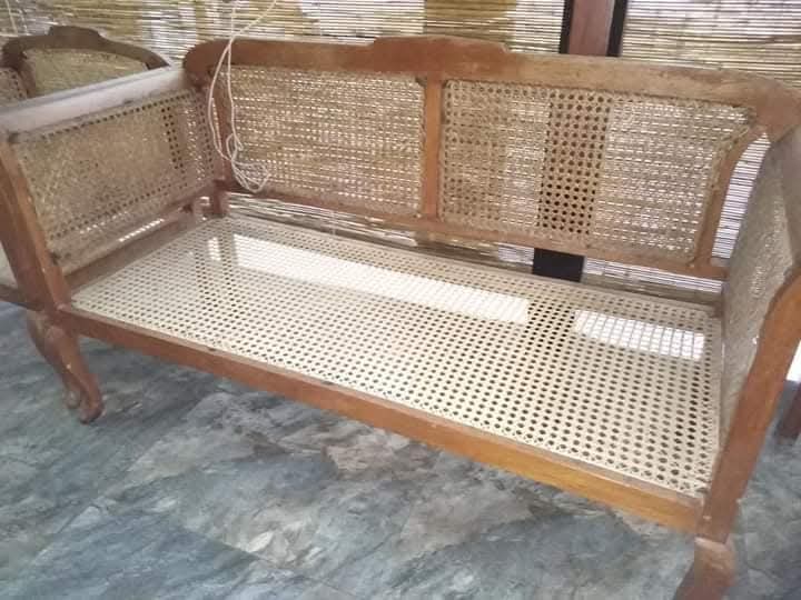 Long cane settee after with new upholstery