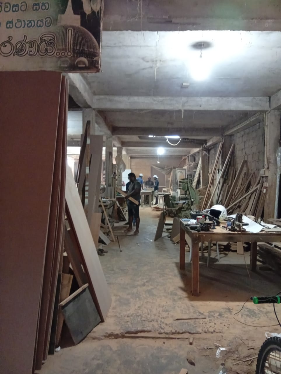 Workshop aisle with machines and timber